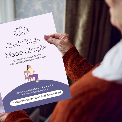 An older persons hands holding front page of Yoga book
